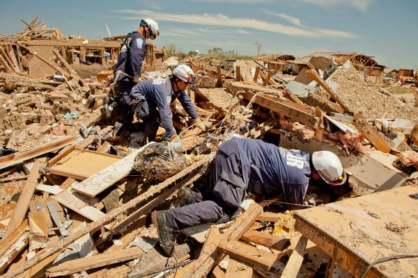 rescuers remove debris