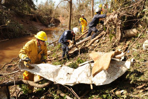 rescuers remove debris