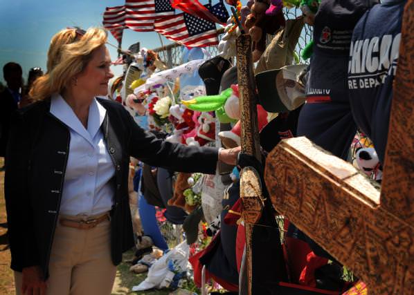 Governor Mary Fallin stops at the memorial set up at Plaza Towers Elementary School to pay her respects.